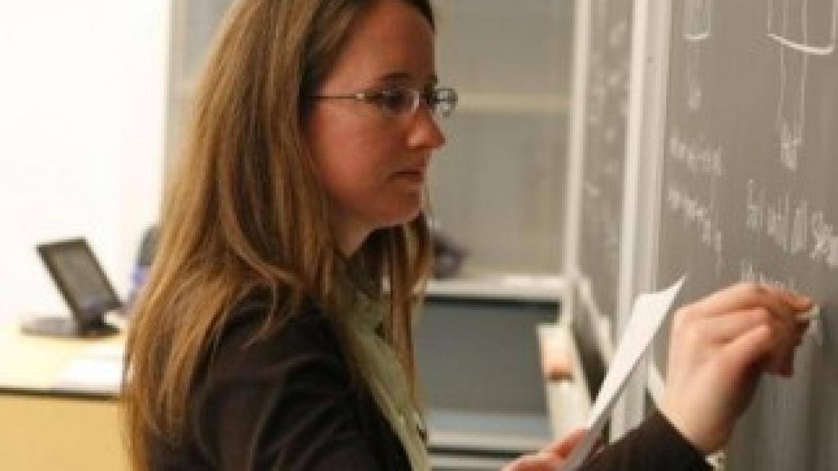 3115_teacher_writing_on_a_blackboard