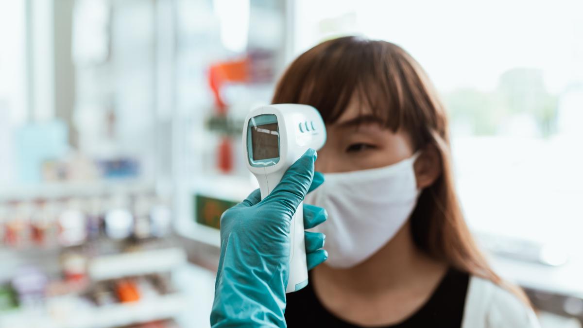 woman-wearing-a-face-mask-getting-her-temperature-checked-4429561_05229800