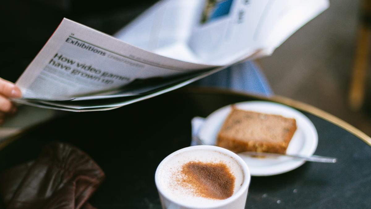 person-having-a-coffee-and-reading-a-newspaper-3626610_34553900