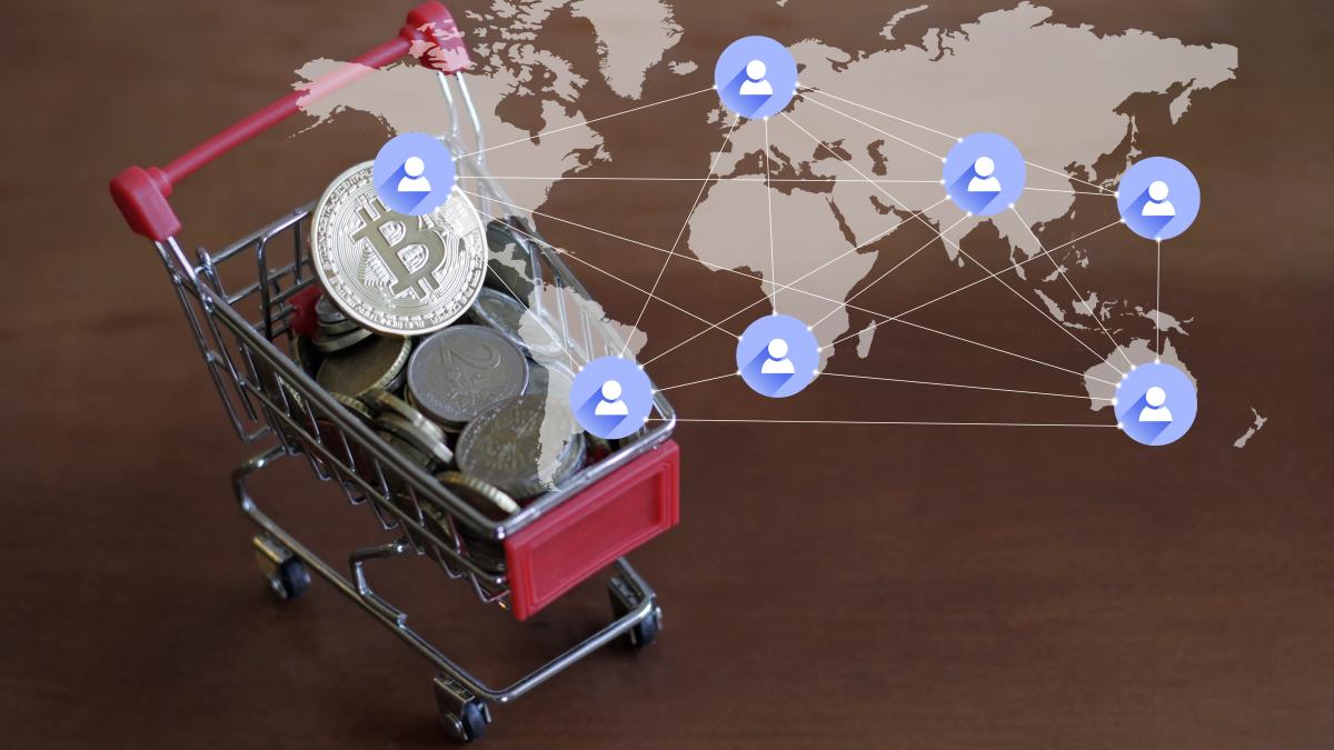 illustration_of_world_map_connection_and_small_trolley_with_coins_and_bitcoin_on_top-scopio-cf2eb698-141d-4cd0-9461-b7835e45ecba_75344300