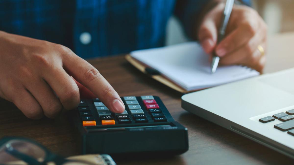 close-up-man-hand-using-calculator-calculate-numbers-other-hand-is-taking-notes-2_89885500