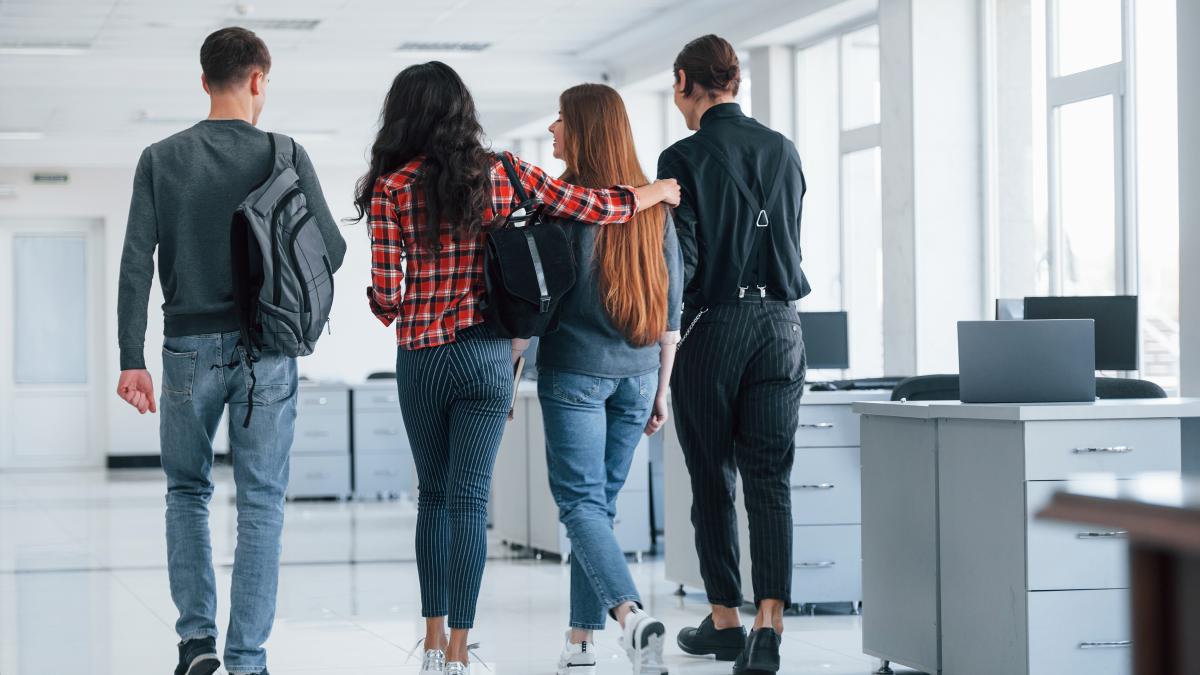 friendly-embracings-group-young-people-walking-office-their-break-time_92817500