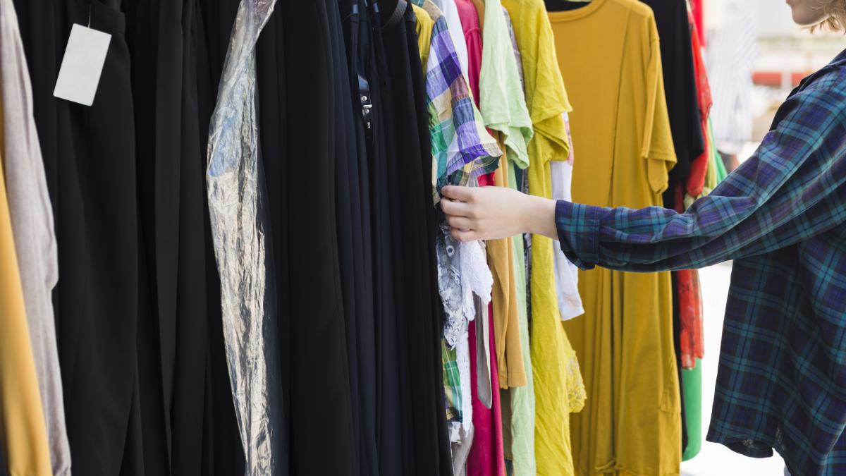 young-woman-choosing-different-outfits_89248800