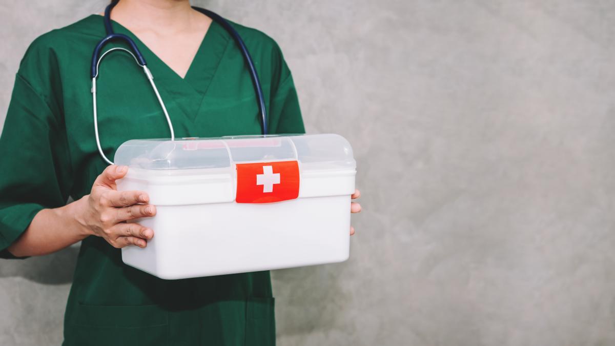 portrait-asian-woman-doctor-wearing-uniform-carrying-first-aid-box-kit-with-copy-space-background_05026700