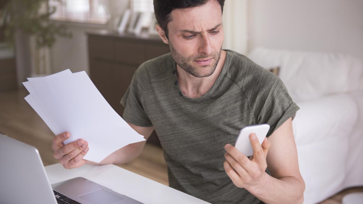 young-man-working-home-with-his-laptop_94009000