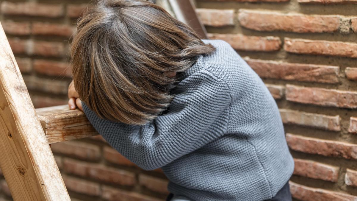 little-boy-outdoors-upset_54792200