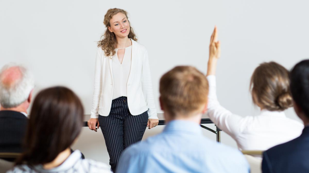 business-woman-giving-lecture_78384400