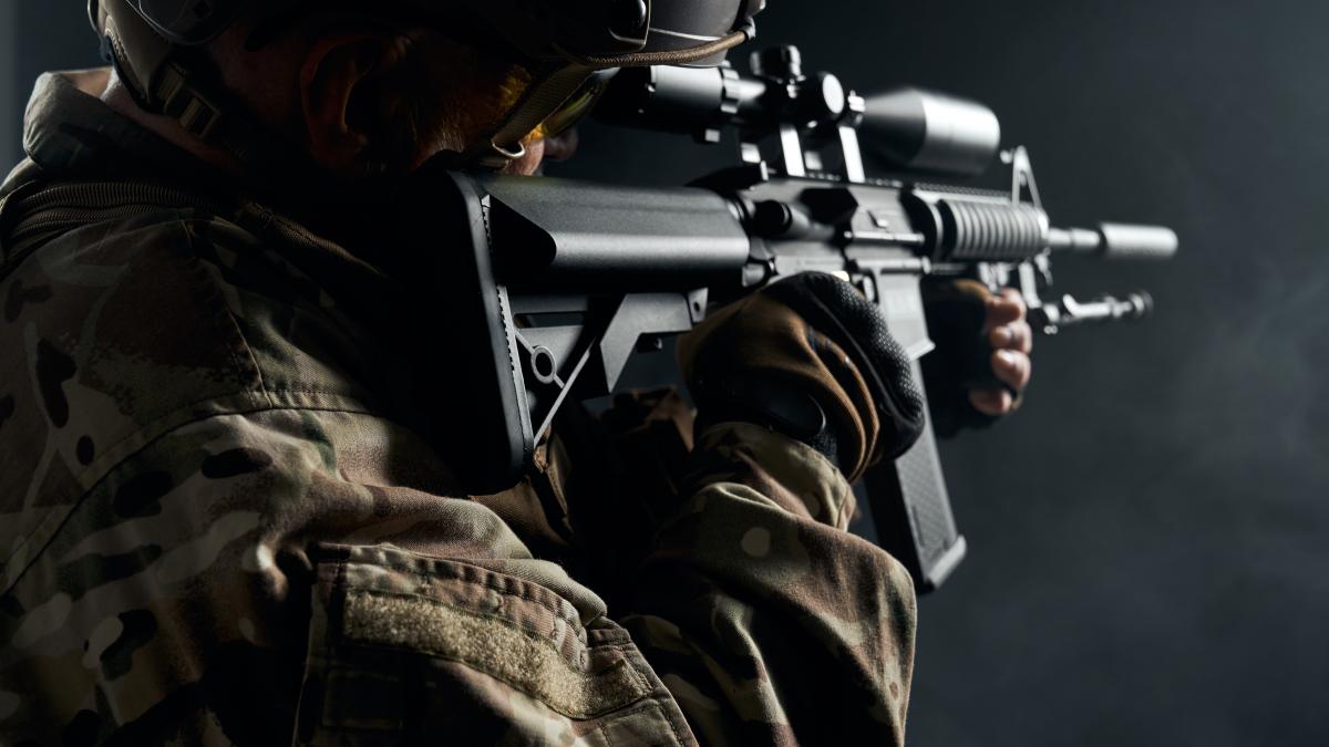 old-soldier-uniform-pointing-with-sniper-rifle_38648100