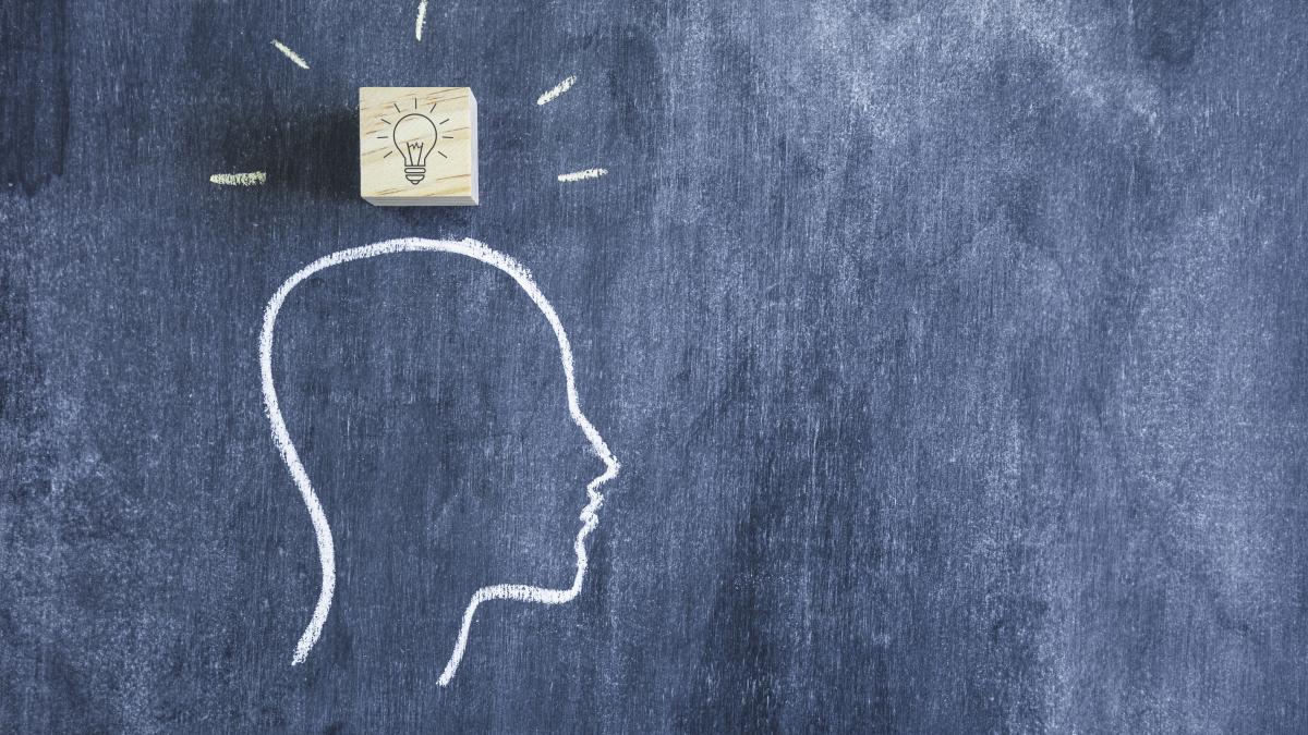 wooden-light-bulb-block-head-outline-face-chalkboard_90098300