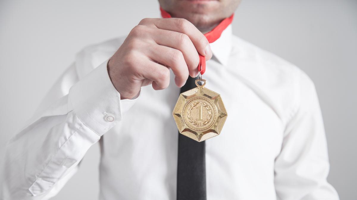businessman-with-gold-medal-medal-awards-winner_16136100