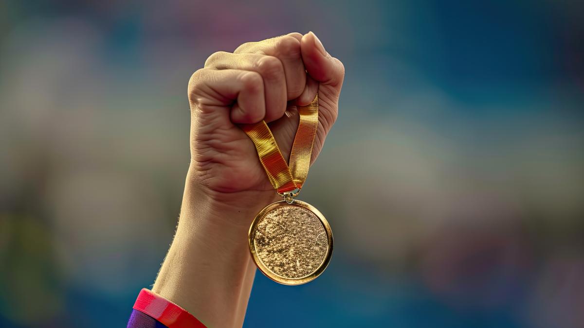 hand-woman-raising-olympic-gold-medal-victory_25533900_49631500