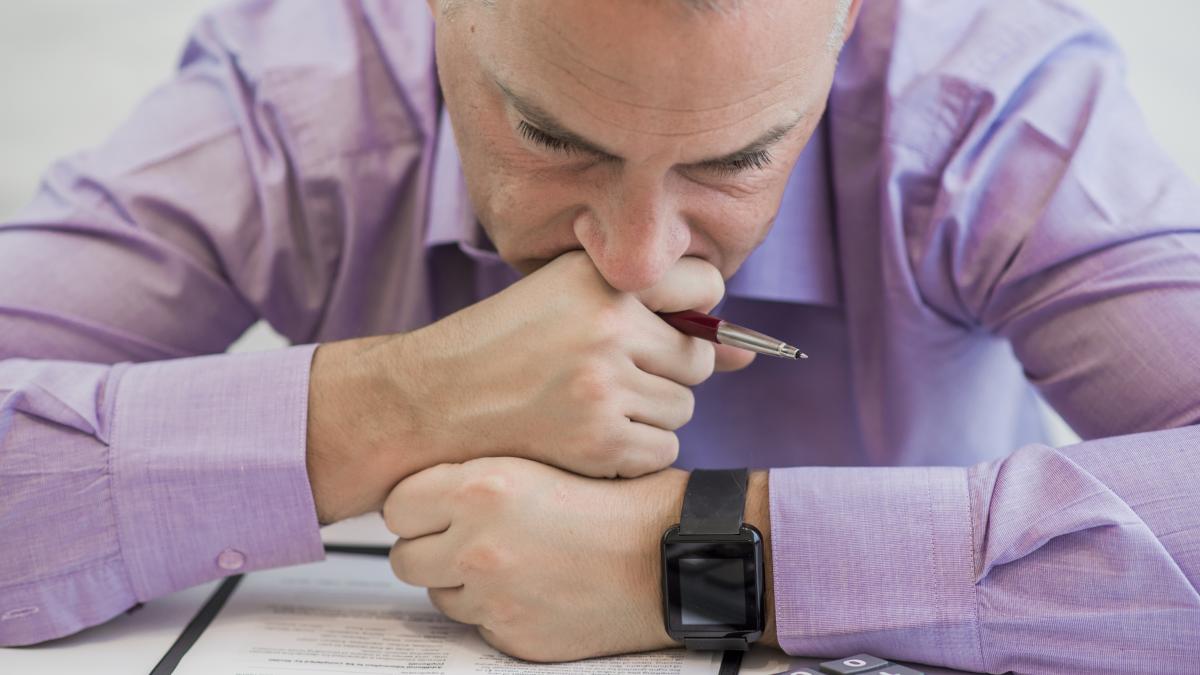 anguished-sad-depressed-lonely-business-man_77985700