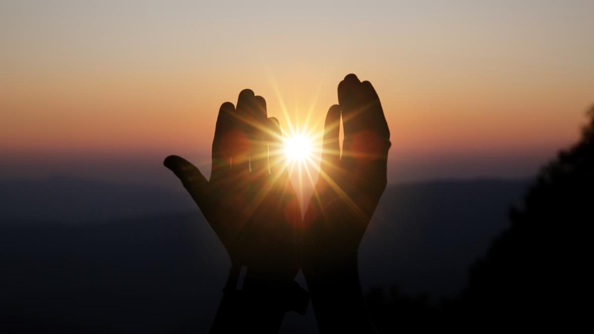 spiritual-prayer-hands-sun-shine-with-blurred-beautiful-sunset_90356000
