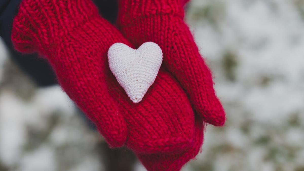 gloved-hands-holding-white-heart_23-2147592059_99514900