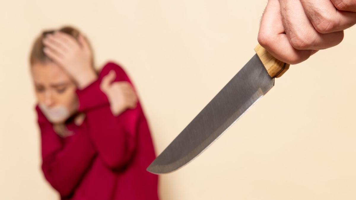 front-view-young-female-red-shirt-with-tied-mouth-scared-knife-cream-space-female-cloth-photo_140725-28703_54958600