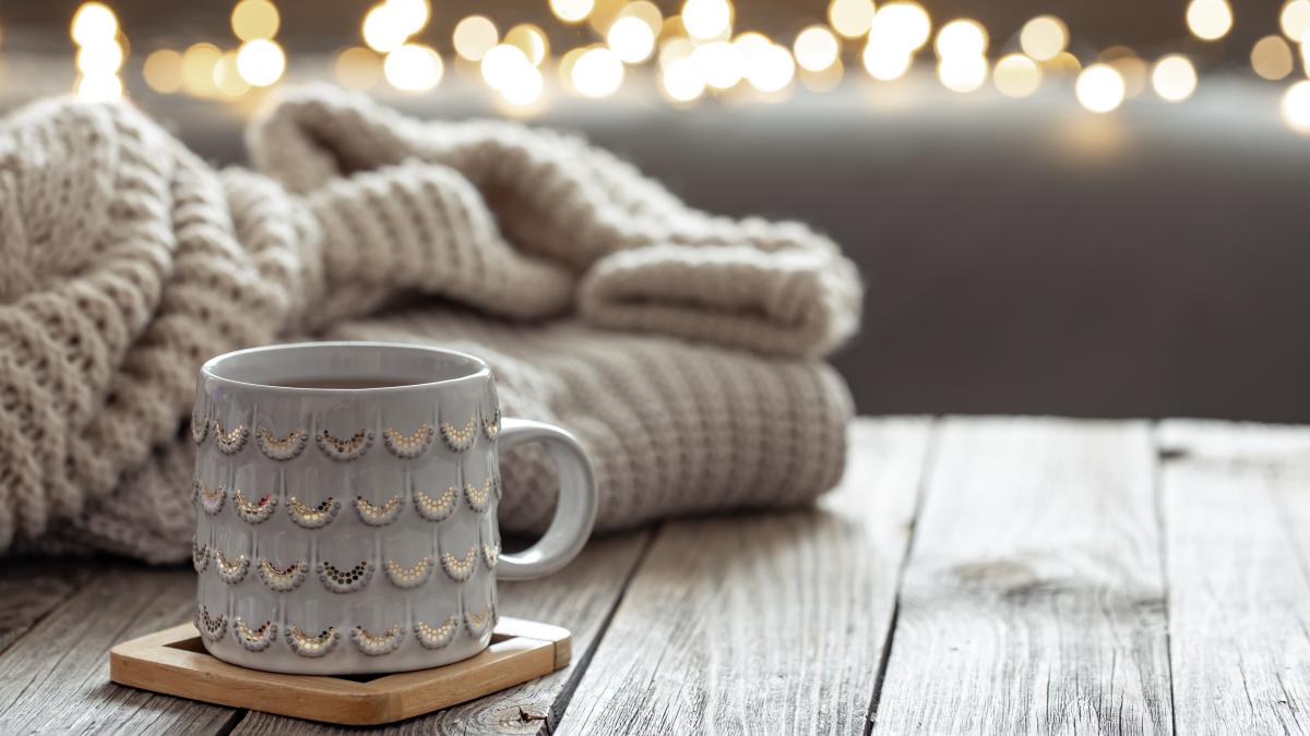 beautiful-christmas-cup-knitted-element-blurred-background-with-bokeh_63123400