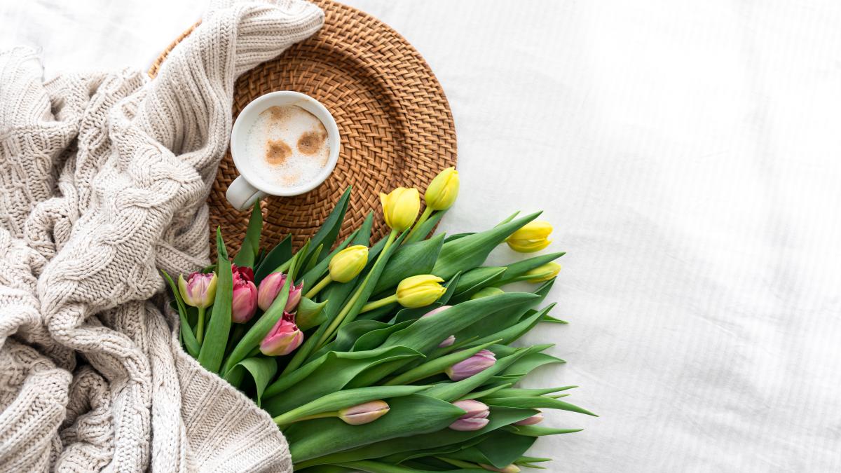cozy-composition-with-flowers-coffee-white-background-top-view_91877500