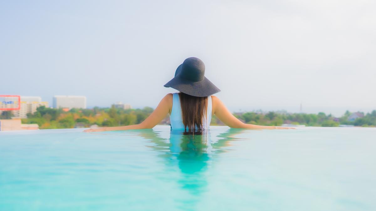 portrait-beautiful-young-asian-woman-happy-smile-relax-around-outdoor-swimming-pool-hotel-resort_54278200