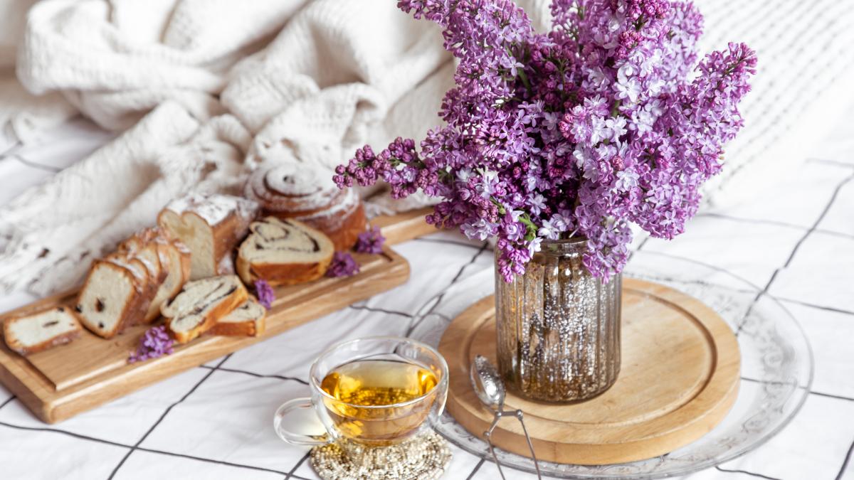 breakfast-brunch-bed-with-pastries-tea-lilac-bouquet-vase-romance-holidays-mother-s-women-s-day_66417900