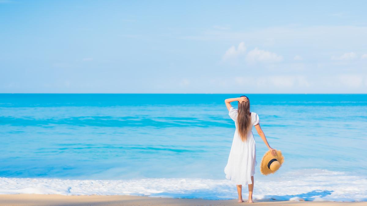 portrait-beautiful-young-asian-woman-relaxing-around-beach-with-white-clouds-blue-sky-travel-vacation_24270800