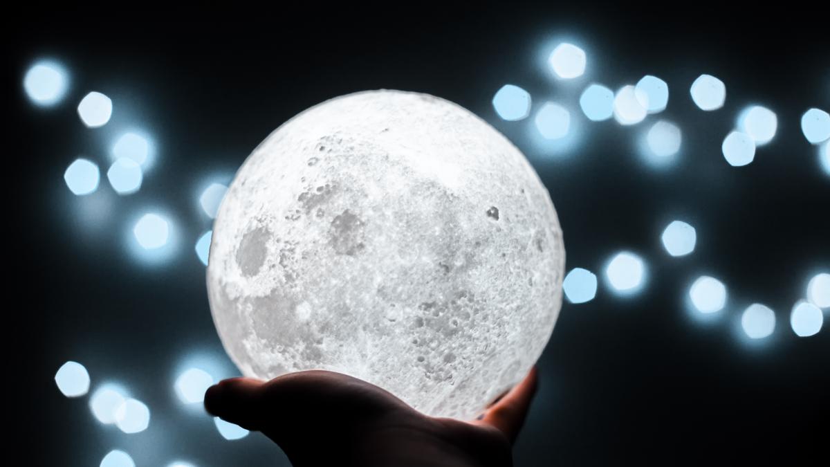 cropped-hand-person-holding-illuminated-lighting-equipment_83435200