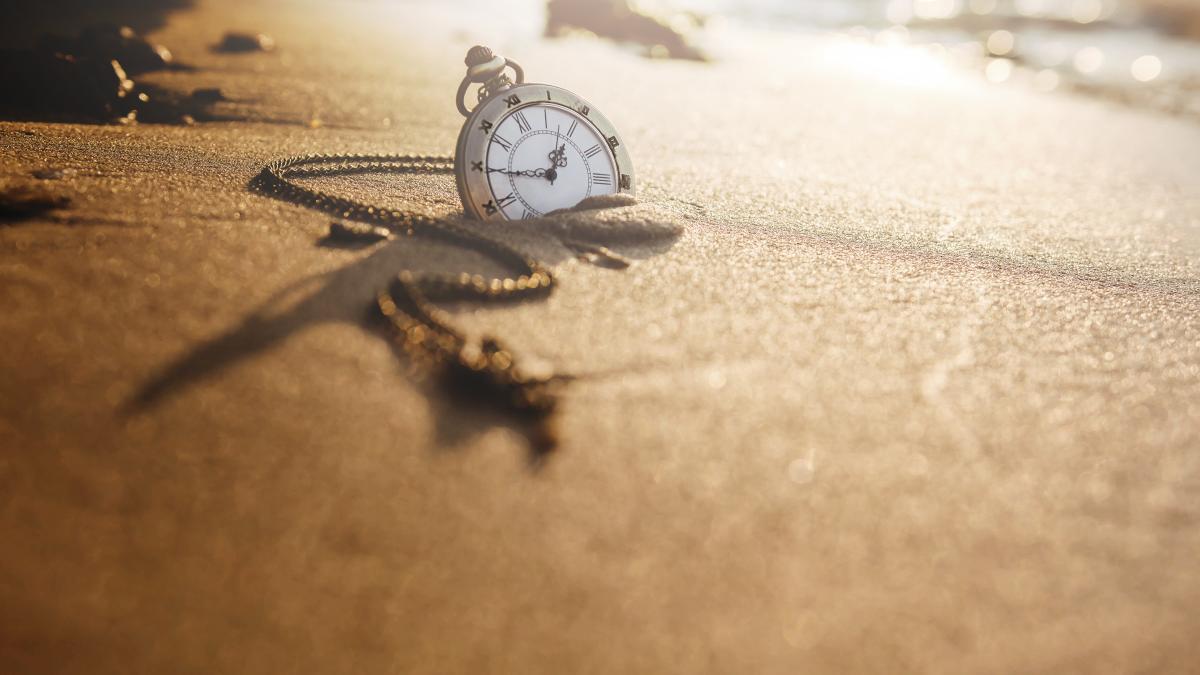 vintage-pocket-watch-golden-sand-beach_88583200