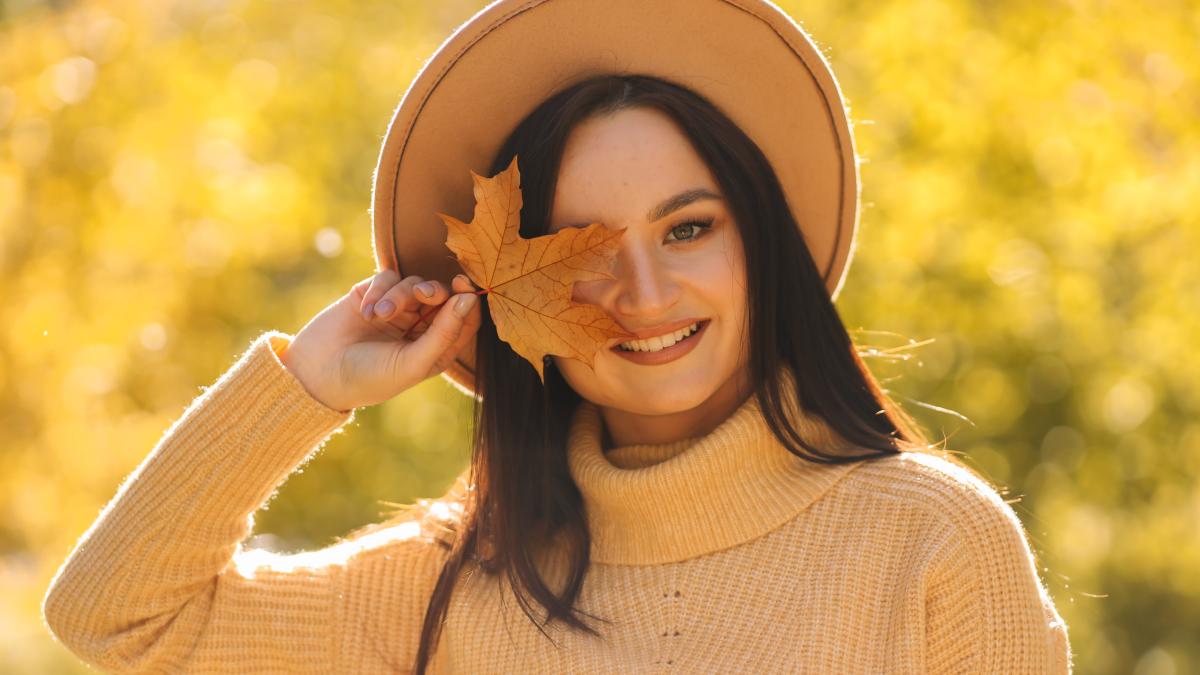 happy-smiling-young-woman-warm-clothes-walks-autumn-park-nature-fall_03357500