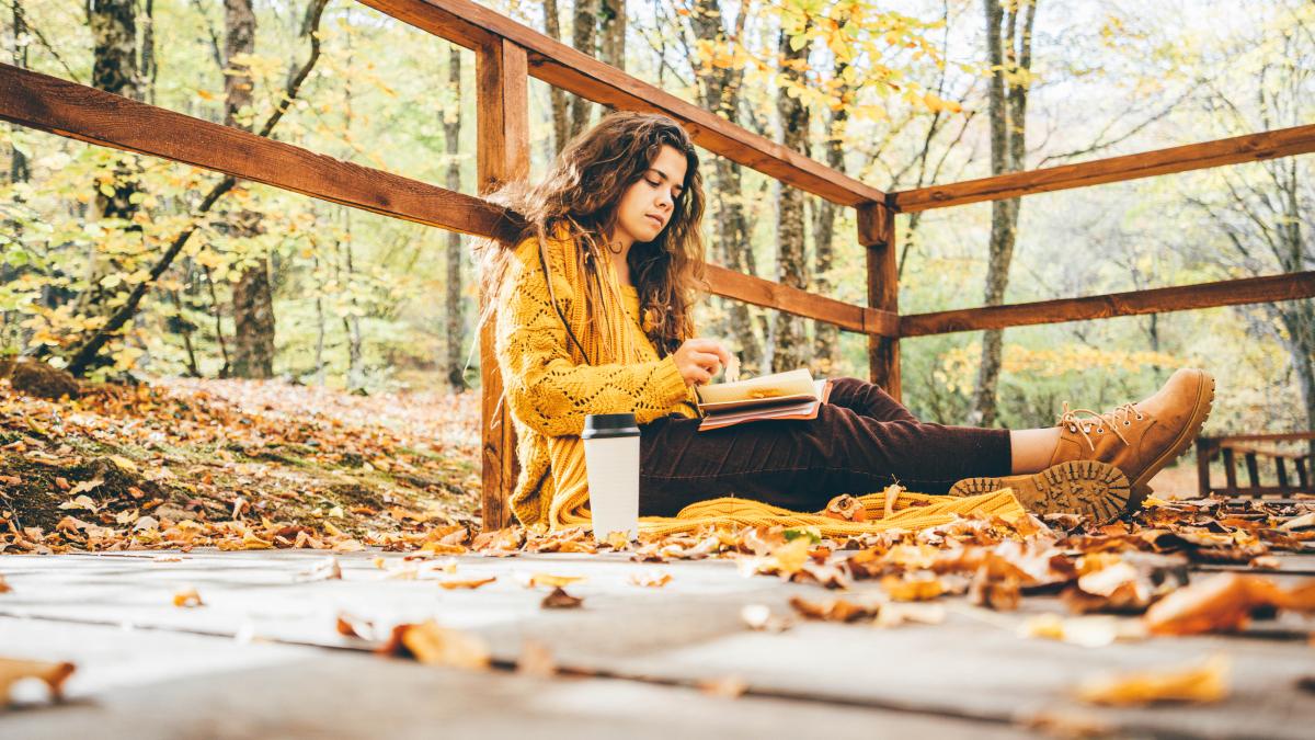 portrait-young-woman-sitting-table_54549500