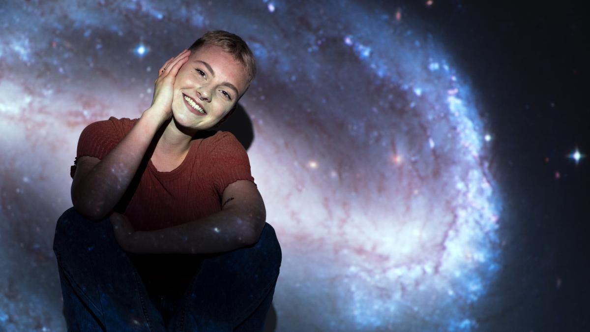 portrait-young-woman-posing-with-universe-projection-texture