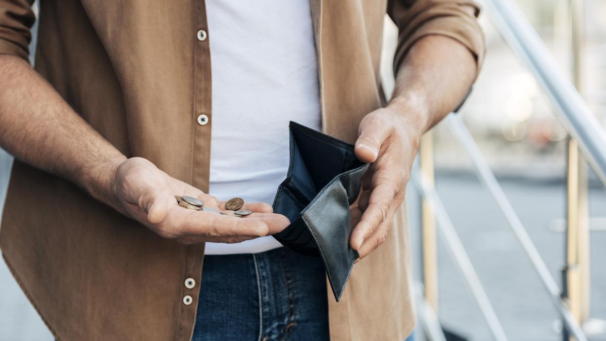 close-up-hands-holding-wallet-coins