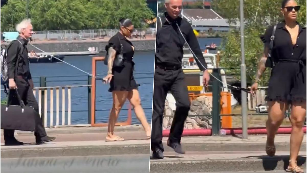 scena care a aprins internetul un barbat in varsta cu valiza plimbat in lesa pe strada de o femeie video