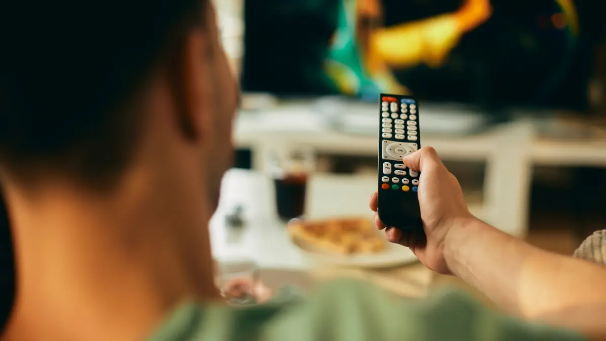 closeup-man-watching-tv-home