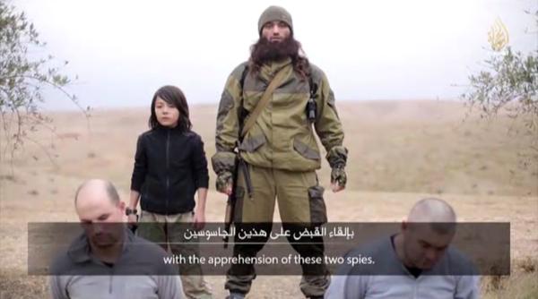 execu ie stat islamic isis cere unui copil sa execute doi spioni ru i video