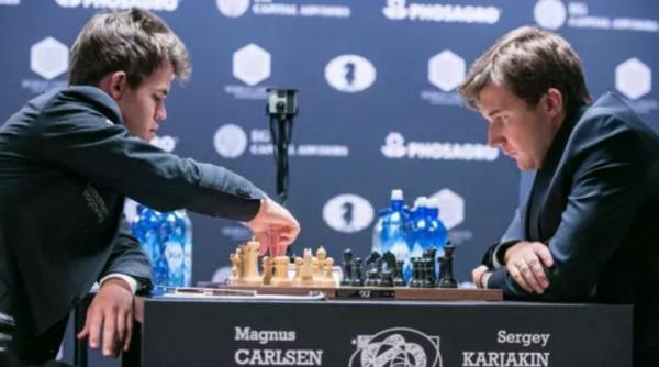 ah titlul mondial care este scorul dintre magnus carlsen i serghei kariakin
