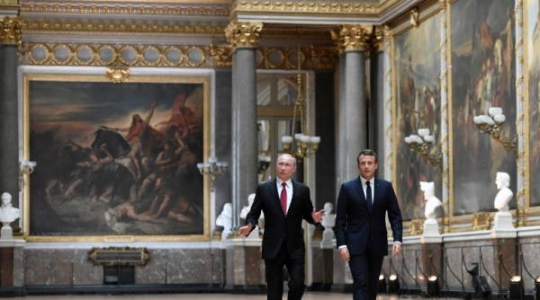 macron discu ie la telefon cu merkel i putin eforturi comune