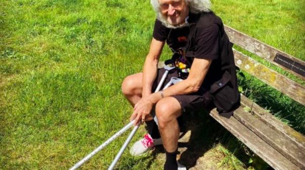 legendarul chitarist al trupei queen aproape de moarte dupa un infarct