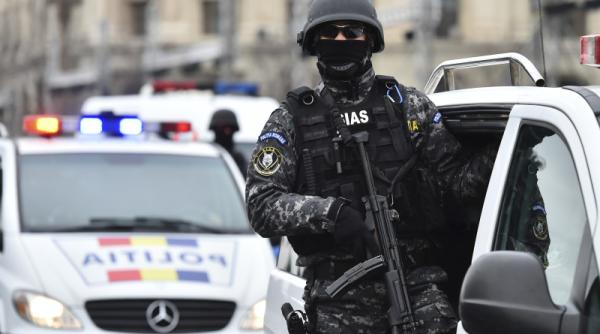 politist sas atacat cu toporul in capitala
