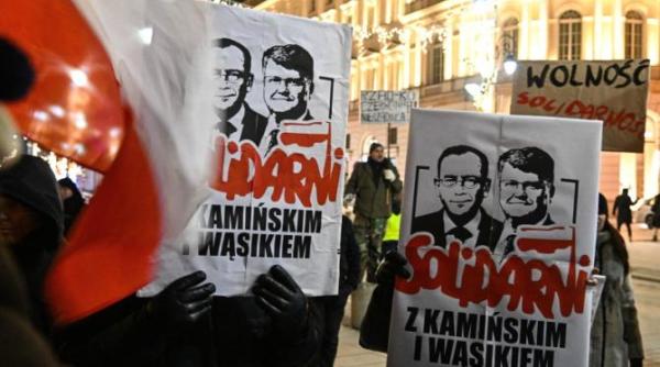 presedintele andrzej duda gratiaza doi membri ai fostului guvern din polonia cere eliberarea lor imediata din inchisoare reuters