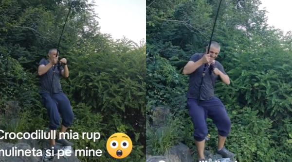 un pescar roman a reusit sa prinda un somn urias barbatul aproape a fost smuls de pe tarm video viral