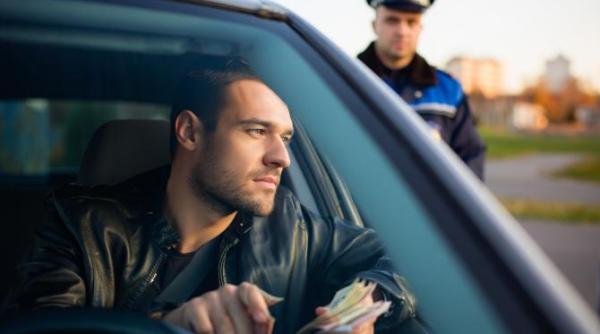 un sofer din bucuresti a oferit 500 de lei unui politist care voia sa i suspende permisul cum s a incheiat totul