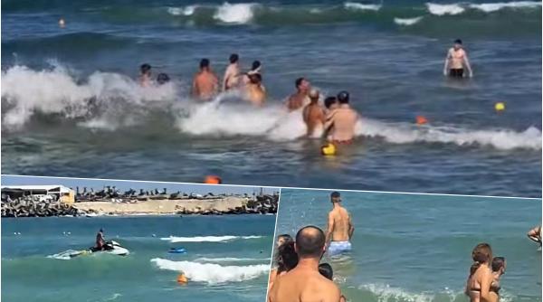 steagul rosu ignorat din nou pe litoral un turist a fost salvat de doua ori de la inec o fetita a ajuns in larg video